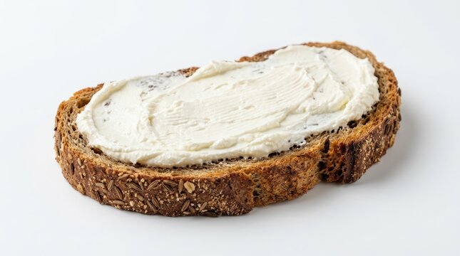 Freshly baked bread slice topped with creamy white cheese spread.