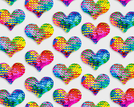 Colorful glittering hearts pattern, love symbol of sparkling sequins rainbow colors, trend repeated layout from toys shape heart, creative romance holiday design, festive Valentine designs wallpaper.