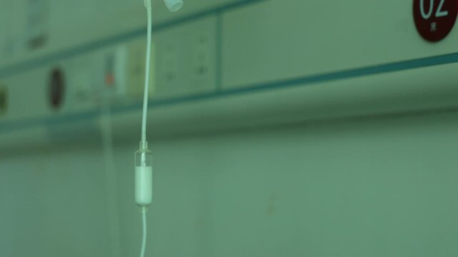 closeup of the Murphy's drip chamber driping in hospital