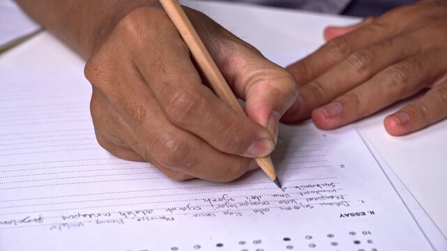 Hand writing essay answer on exam test paper