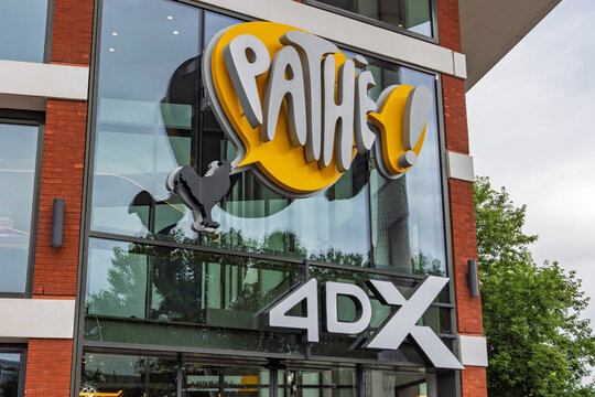 Zwolle, Netherlands - August 23, 2026: Entrance facade of a modern Path&eacute; cinema featuring the bright yellow Path&eacute; logo and large 4DX movie experience signage on glass.