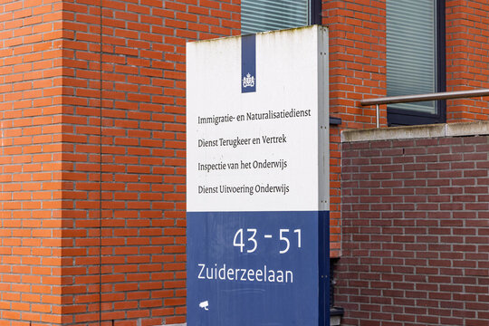 Zwolle, Netherlands - August 23, 2026: Signboard outside the Dutch Immigration and Naturalisation Service (IND) office building located on Zuiderzeelaan.