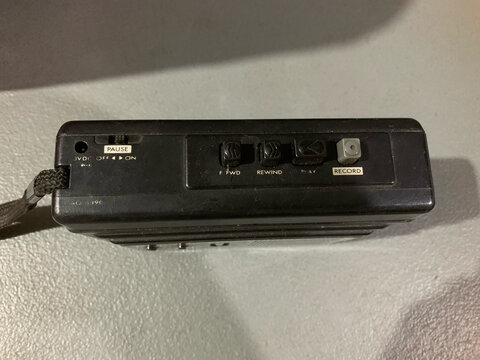 Voice recorder top view with play pause forward rewind record buttons