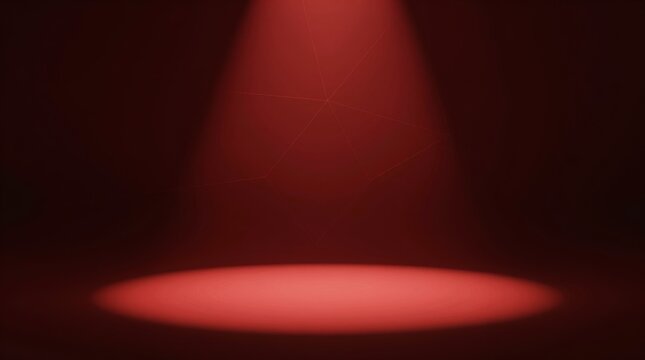 Red spotlight illuminates a dark stage. Faint dust particles drift in the air