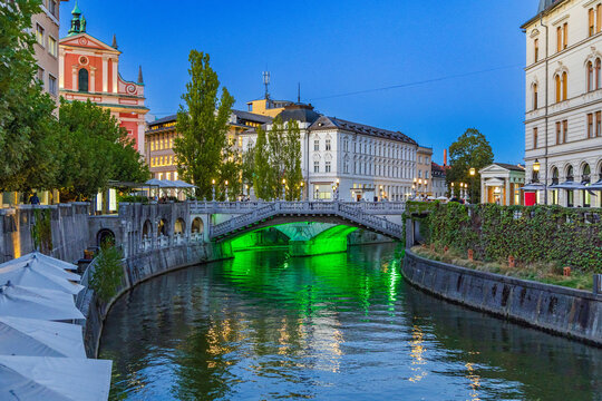Ljubljanica river bridges and Tromostovje in city of Ljubljana in the evening, Slovenia 