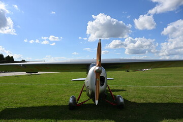 Wooden Propeller with Blue Sky and White Clouds in the Background © Miroslaw