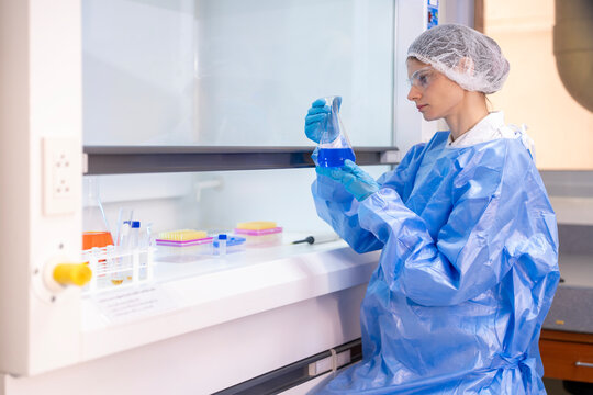 Medical Research Laboratory Portrait of a Beautiful Female Scientist in Goggles Using Micro Pipette for Test Analysis. Advanced Scientific Lab for Medicine, Biotechnology, Microbiology Development