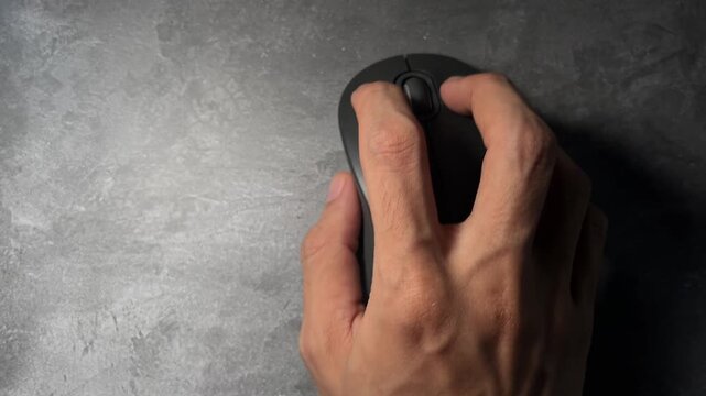 man hand using black computer mouse on desk