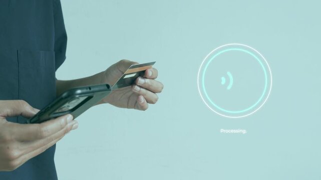 Casual man holding credit card and smart phone for successful touchless digital payment