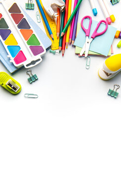 Colorful school and art supplies on white background