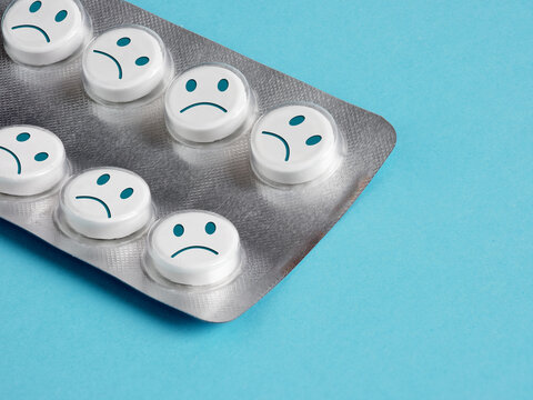 Sadness pills representing antidepressants and mental health