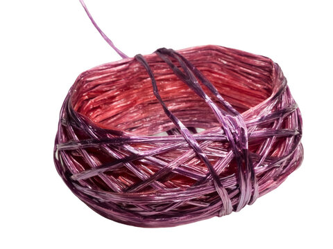 Roll of purple plastic raffia string twine for packaging and tying object