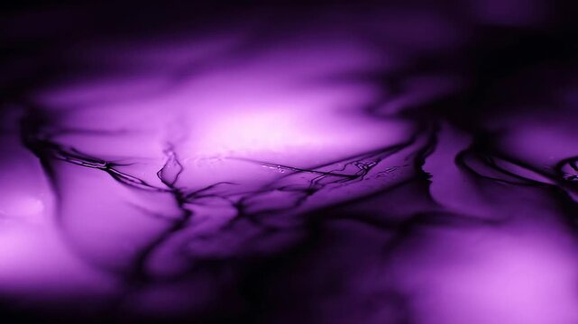 Abstract purple liquid background with dark flowing ink motion