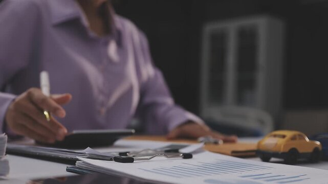 Car sale or rental concept, Closeup Dealership manager signing car insurance document or lease paper contract. Customer with car dealer agent making deal, sign on agreement document contract in office