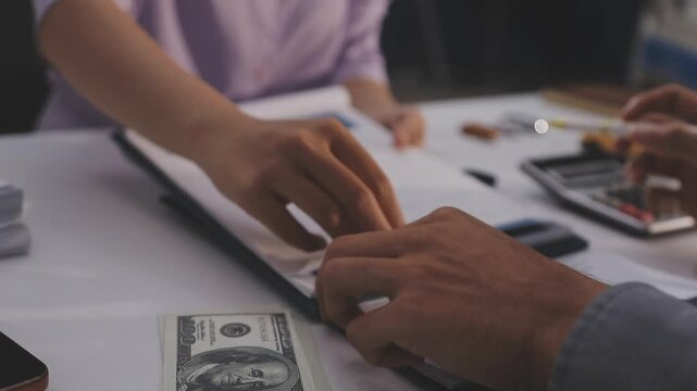 Car sale or rental concept, Closeup Dealership manager signing car insurance document or lease paper contract. Customer with car dealer agent making deal, sign on agreement document contract in office