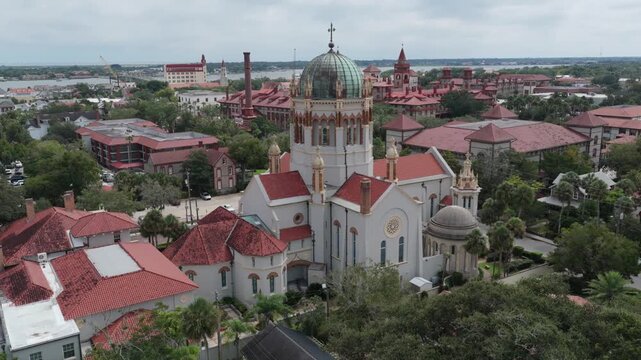 Aerial view of Memorial Presbyterian Church with its distinctive dome and red roofs surrounded by historic architecture in St. Augustine, Florida, United States.