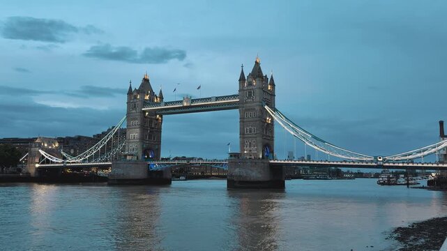 Illuminated Tower Bridge over River Thames at blue hour