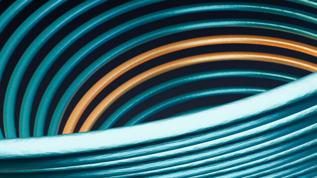 Coiled blue and orange rubber hoses in spiral pattern