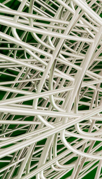 Entangled white cables forming complex mesh in technology close-up