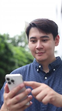 slow motion young man hand hold smartphone to surfing the internet and check work or mail on website while sit in the living room in weekend for business technology and lifestyle concept