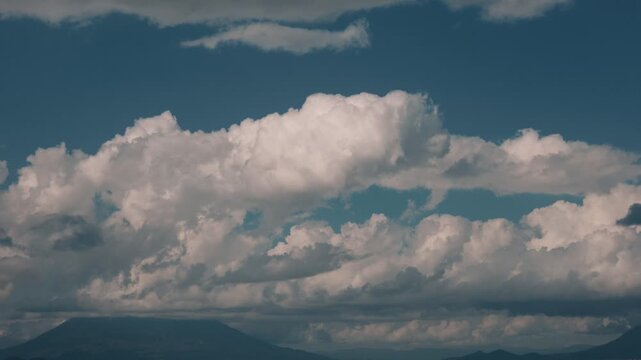 Rising cumulus clouds over Mount Yotei