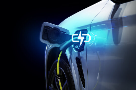 Power cable pump plug in charging power to electric vehicle EV car.