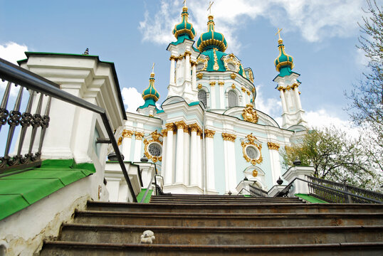 White orthodox church with dark green and golden domes, Kiev, Ukraine
