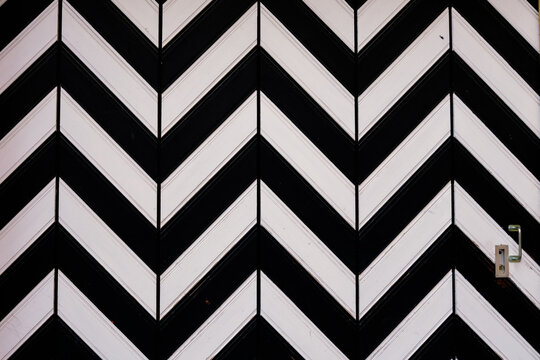 Decorative wooden door with black and white pattern