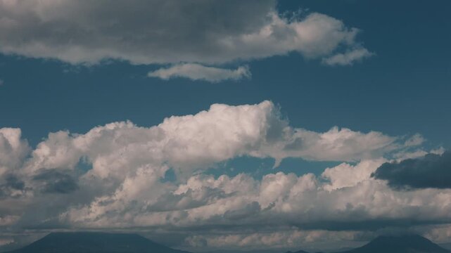 Rising cumulus clouds over Mount Yotei