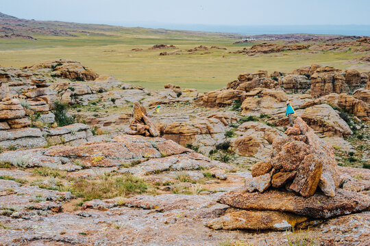 Stone ovoo among granite outcrops in the steppe landscape of Baga Gazriin Chuluu, Mongolia.