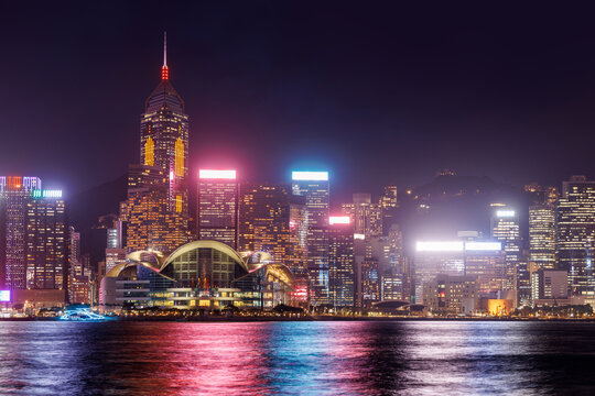 Hong Kong city skyline at sunset with glowing sky and skyscrapers