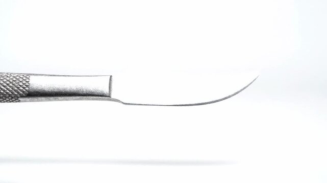 sharp surgical scalpel blade on white background for medical use