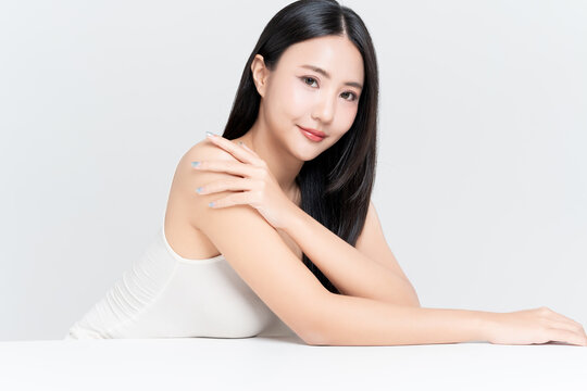 Close up of beautiful young Asian woman with healthy face and body skin, natural makeup,b body slim and black hair. for advertising beauty makeup, skincare and cosmetics concept.