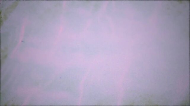 Abstract liquid water ripple texture with soft pink light reflections, distorted fluid surface motion, peaceful