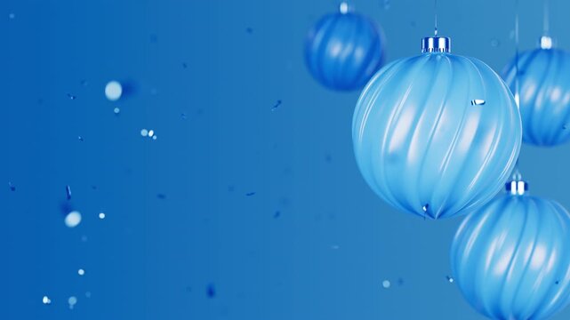 Rotating Matte Blue Christmas Balls and Spherical Baubles with Falling Confetti for Festive Christmas and New Year Eve Celebration