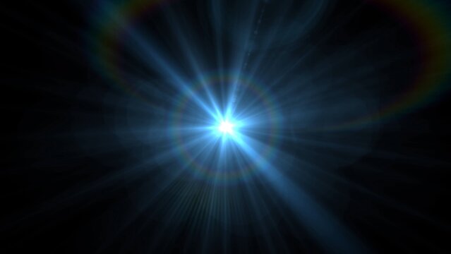 Bright blue light bursts from center, radiating sharp rays. Rays glow vividly