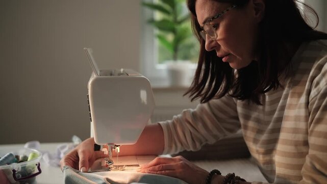 Woman Adjusting Sewing Machine For Diy Home Sewing