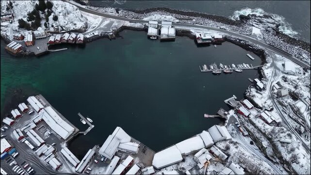 Aerial Overhead View of Snow-Covered Fishing Harbor and Boats in Hamnoy Lofoten Norway Winter