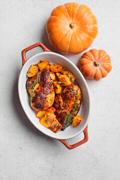 Autumn meal: roasted chicken breast and pumpkin with herbs