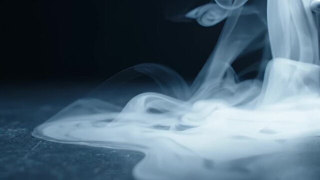 Dense White Smoke Flowing and Swirling Across Dark Surface in Slow Motion