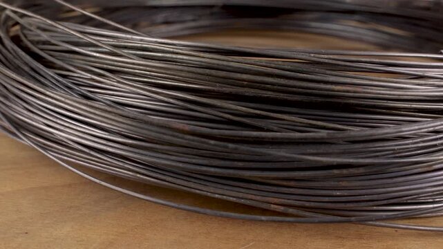 Bundled Black Annealed Steel Wire for Construction used for tying, reinforcement and general construction work, with layered strands and strong industrial texture.