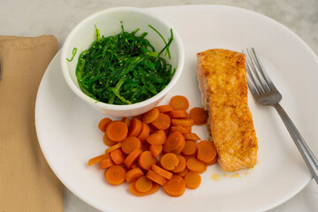 baked salmon  with seaweed salad and carrots © dmiller324