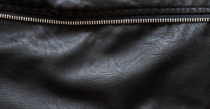 Black leather texture background with metal zipper
