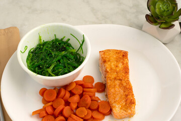 baked salmon  with  seaweed salad © dmiller324