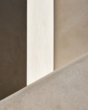 Abstract neutral plaster texture with geometric light shapes for architectural background and minimalist interior design mockup suitable for presentation and templates