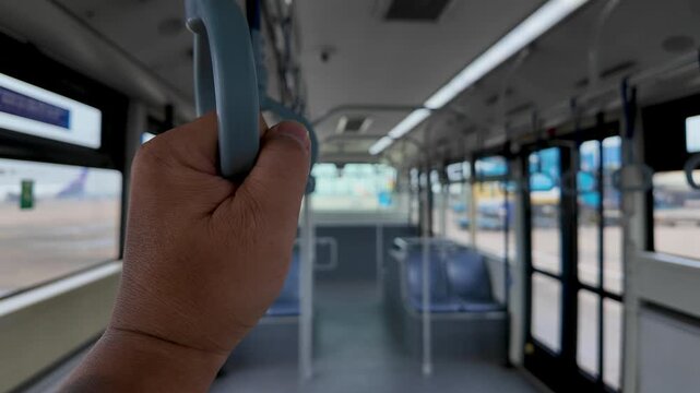 Airplane to terminal transfer bus FLV POV first person view holding the rail