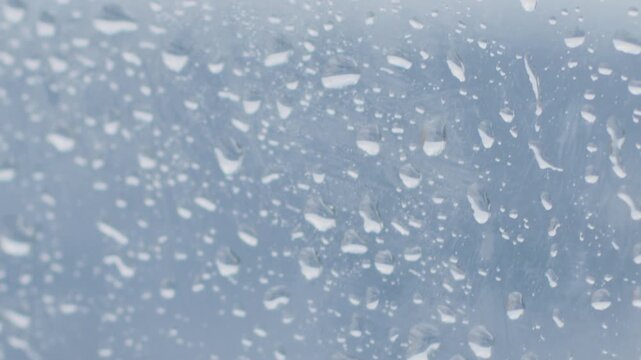 Wet glass surface with the water droplets