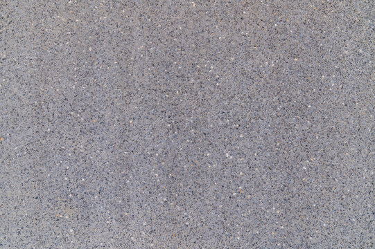 Smooth grey concrete surface showing fine aggregate texture