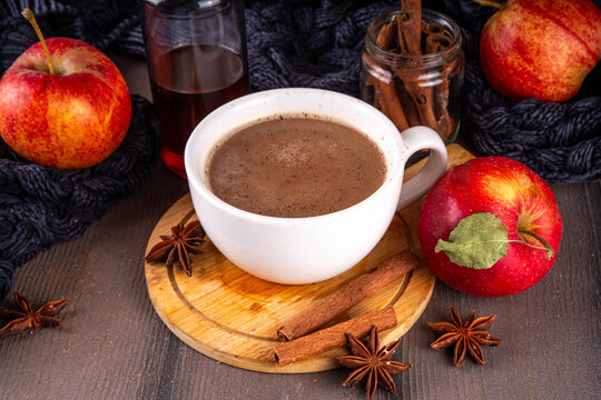 Sweet autumn apple spice coffee latte, warm autumn drink with strong coffee, creamer, fall spices - cinnamon, nutmeg, ginger, cloves, tasty cozy warming beverage