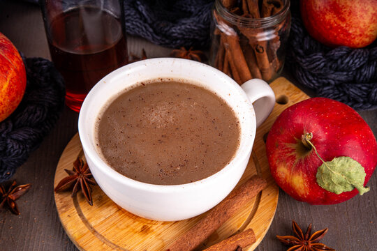 Sweet autumn apple spice coffee latte, warm autumn drink with strong coffee, creamer, fall spices - cinnamon, nutmeg, ginger, cloves, tasty cozy warming beverage